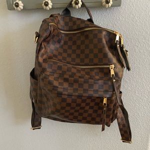 Brown and black checkered backpack